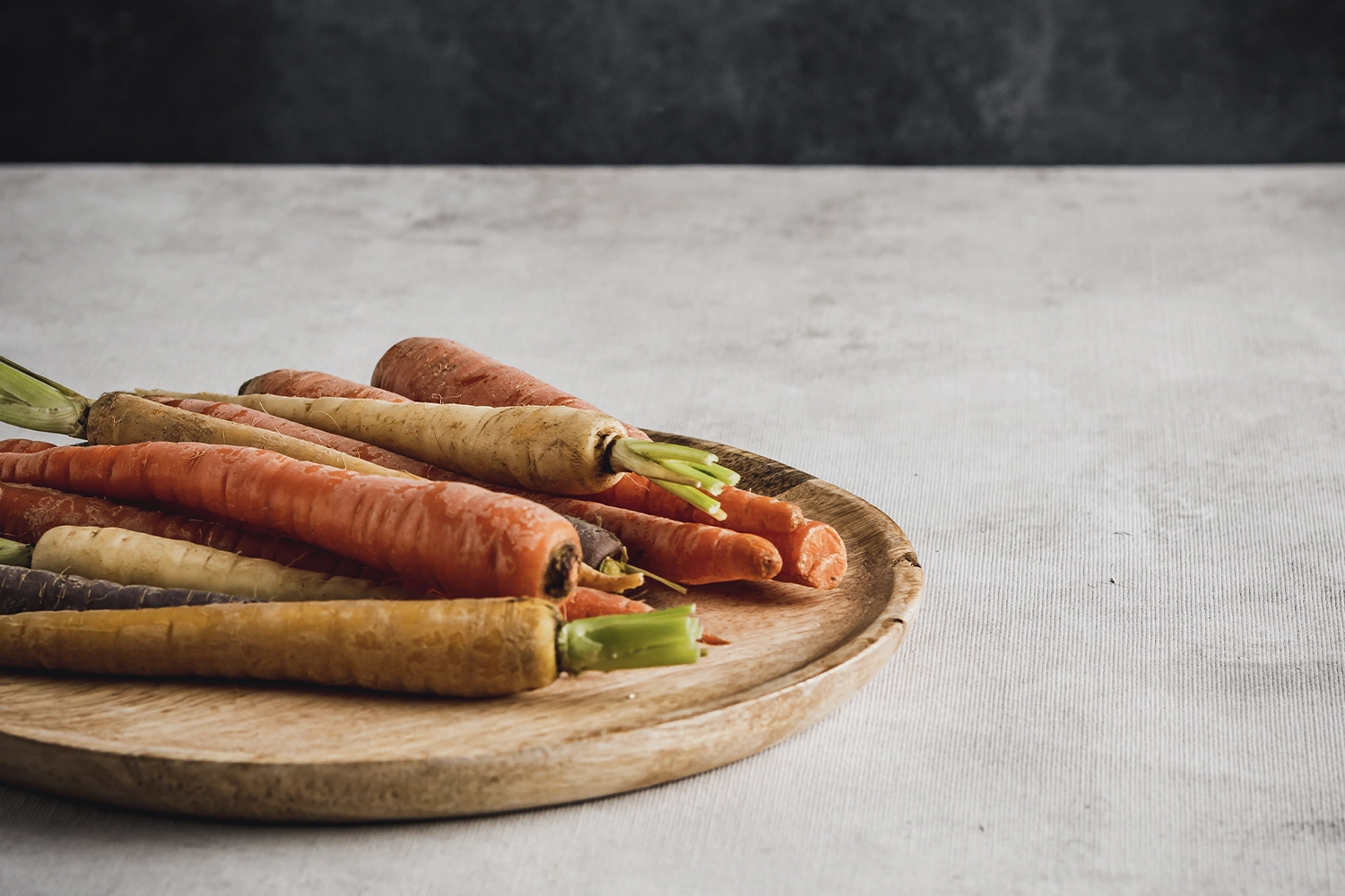 carrots on wooden plate